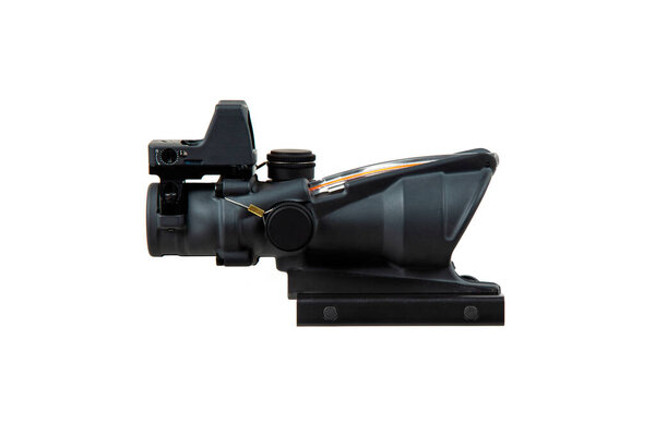 Black ACOG-style rifle scope with a top-mounted red dot sight and quick-release mount.