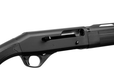 Close-up of the receiver and ejection port of a black semi-automatic shotgun isolated on white.