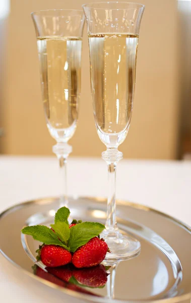 Two champaign glasses and strawberries isolated on white background — Stock Photo, Image