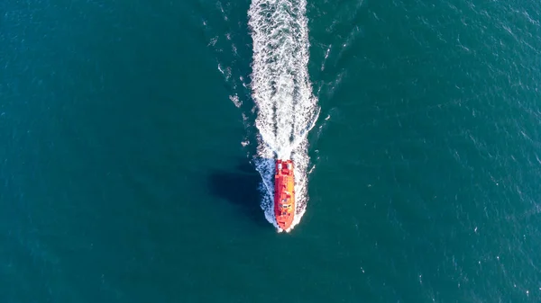 Pilot boat at sea in the port water area. Aerial view
