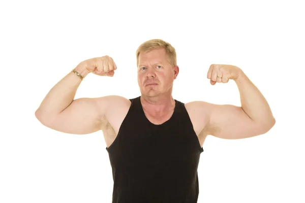 Man in black tank flexing — Stock Photo, Image