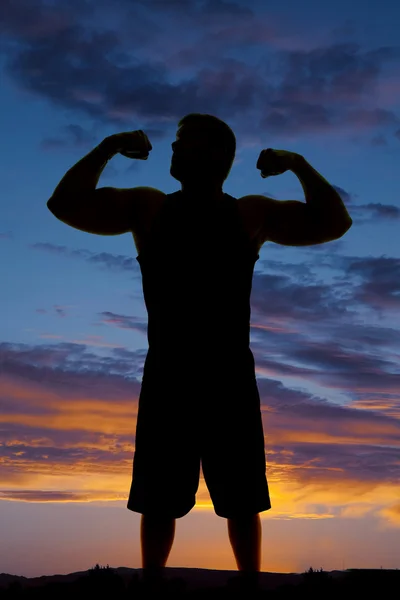 Silhouette of man exercising outdoors — Stock Photo, Image