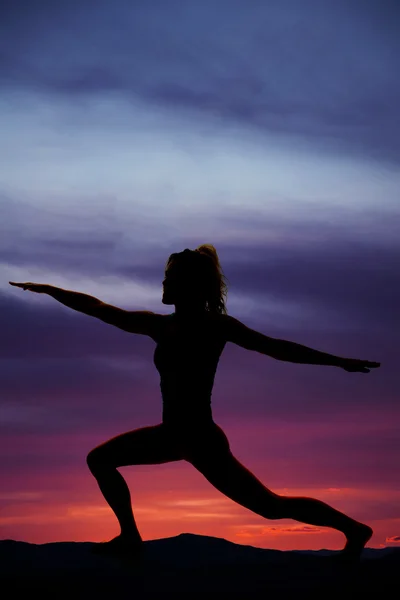 Silhouette of exercising woman outdoors — Stock Photo, Image