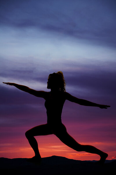 silhouette of exercising woman outdoors