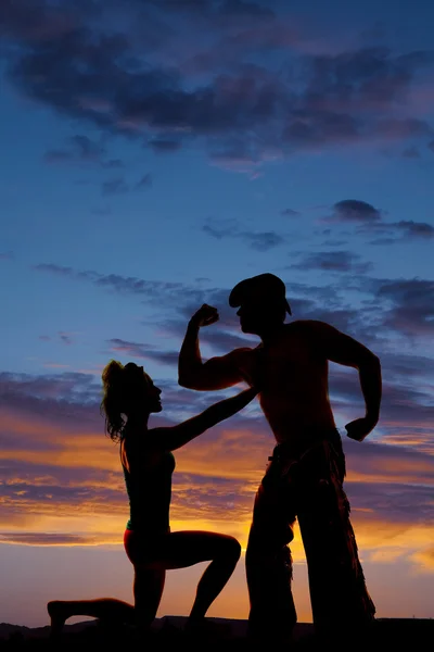 Silhouette of a woman on one knee touch cowboy — Stock Photo, Image