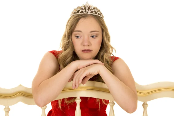 Girl with crown sad leaning on bench — Stock Photo, Image