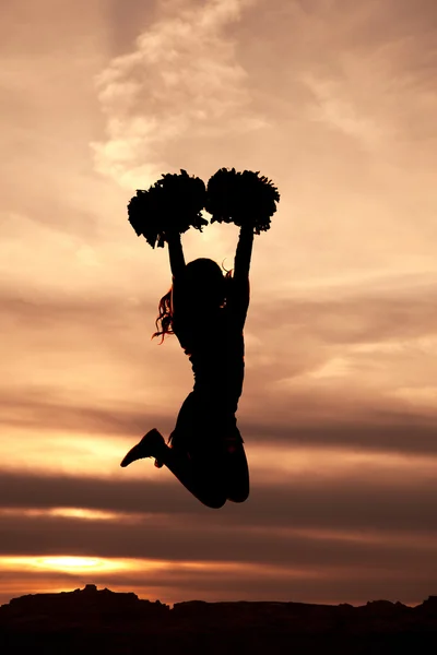 Cheerleader silhouette saltando in aria — Foto Stock