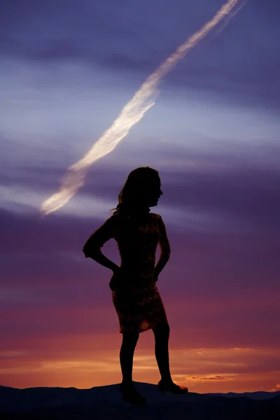 Silhouette of woman standing in dress — Stock Photo, Image