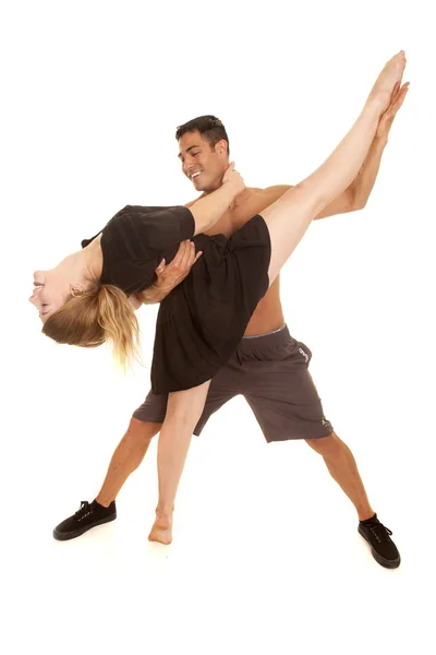 Fitness woman kick up leg by man in plank look down — Stock Photo, Image