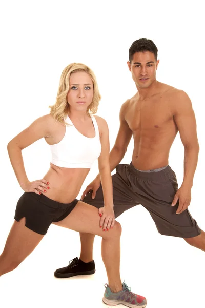 Couple stretch both lunge looking — Stock Photo, Image