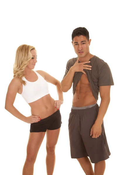 Fitness man show abs woman look — Stock Photo, Image