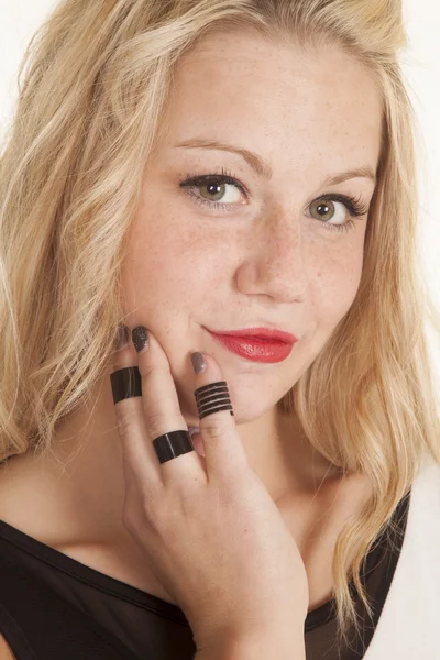 Black rings on fingers by chin — Stock Photo, Image