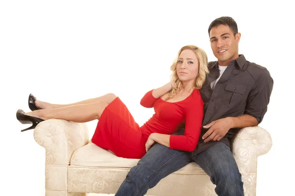 Couple sitting on couch Stock Image