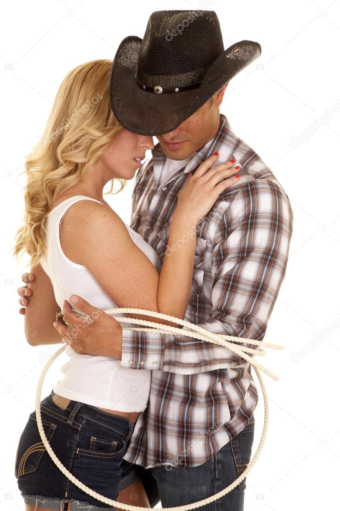 Cowboy and his girl tied up together