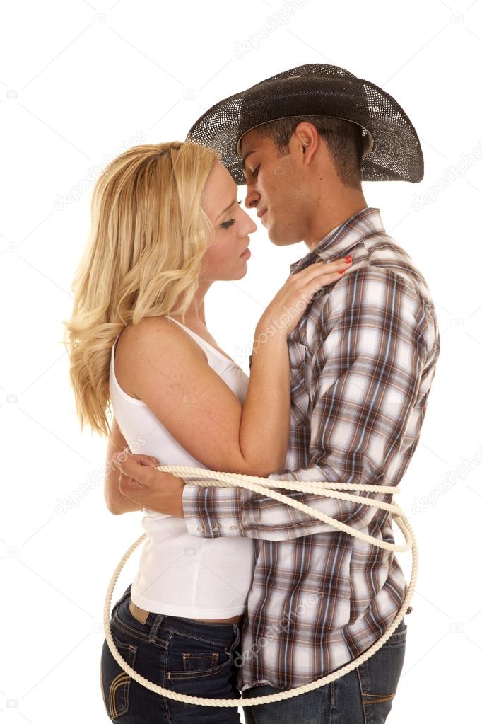 Cowboy and his girl tied up together