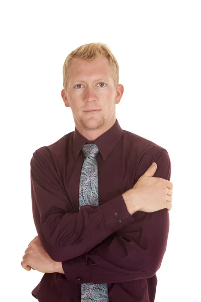 Man in tie purple shirt arms folded looking — Stock Photo, Image