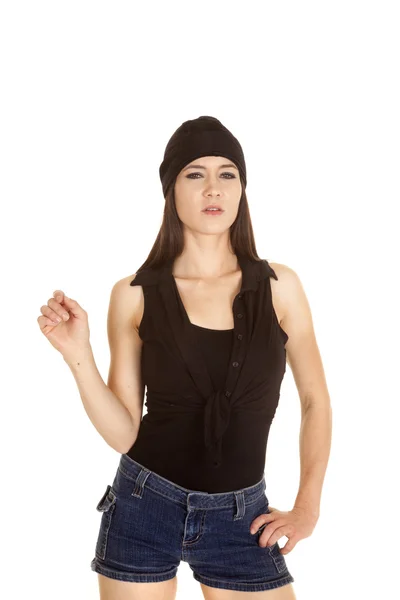 Woman black shirt and hat one hand up serious — Stock Photo, Image