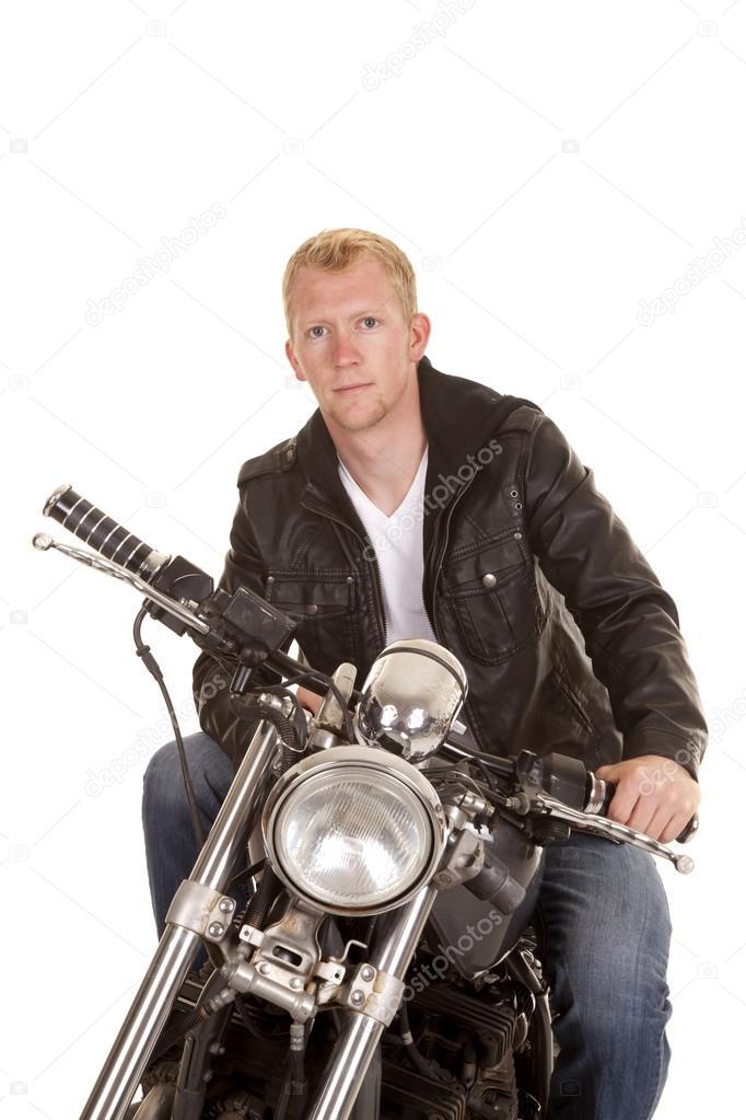 man on motorcycle black jacket look serious