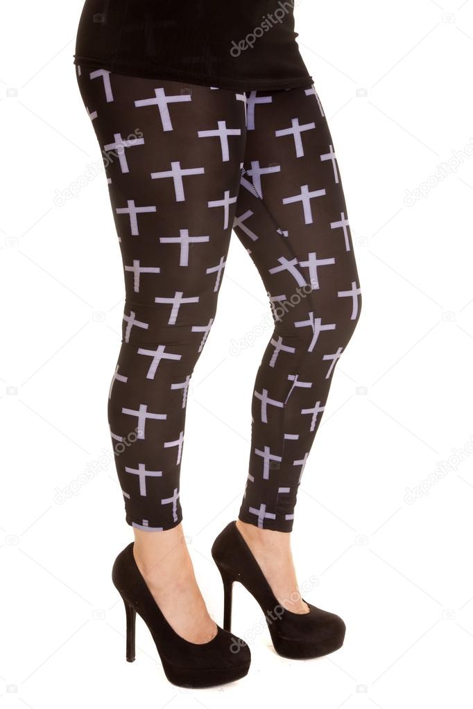 Woman in black leggings with  crosses