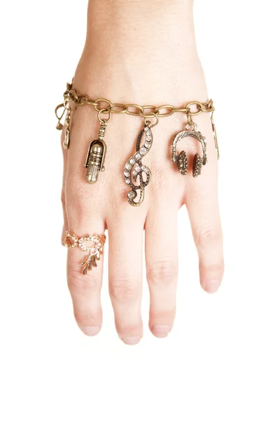 Bracelet with charms hanging — Stock Photo, Image