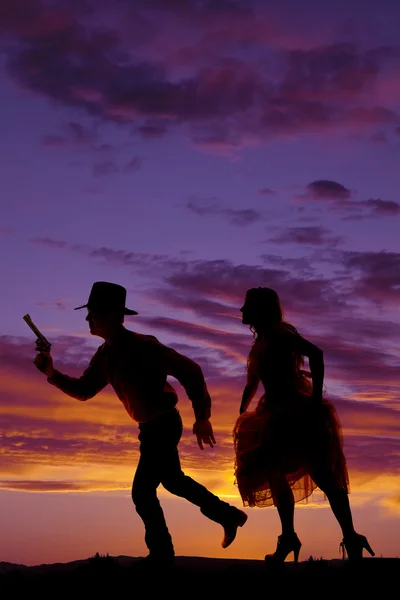 Cowboy with a gun running — Stock Photo, Image