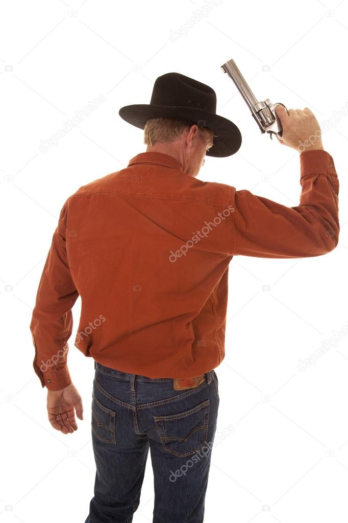back of a cowboy holding up a pistol
