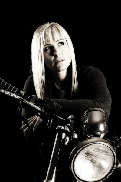 Woman sitting on a motorcycle — Stock Photo, Image