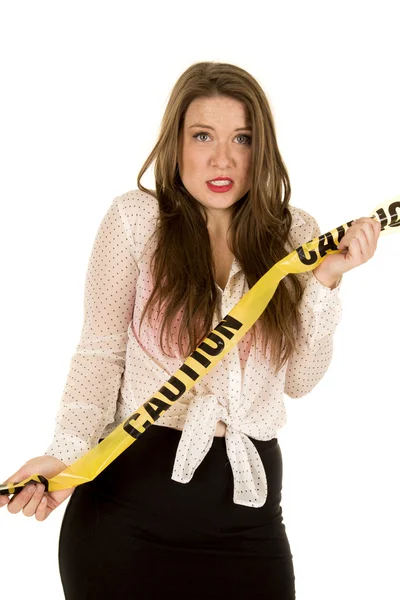 Woman with danger caution tape — Stock Photo, Image