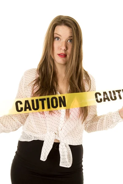 Woman with danger caution tape — Stock Photo, Image