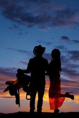 Silhouette bir kovboy ve wooman