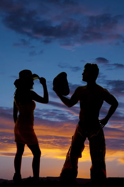 Silhouette di un cowboy e cowgirl — Foto Stock