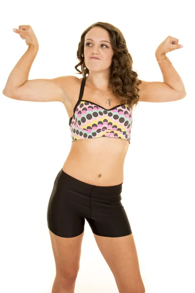 Woman  flexing wearing sport bra — Stock Photo, Image