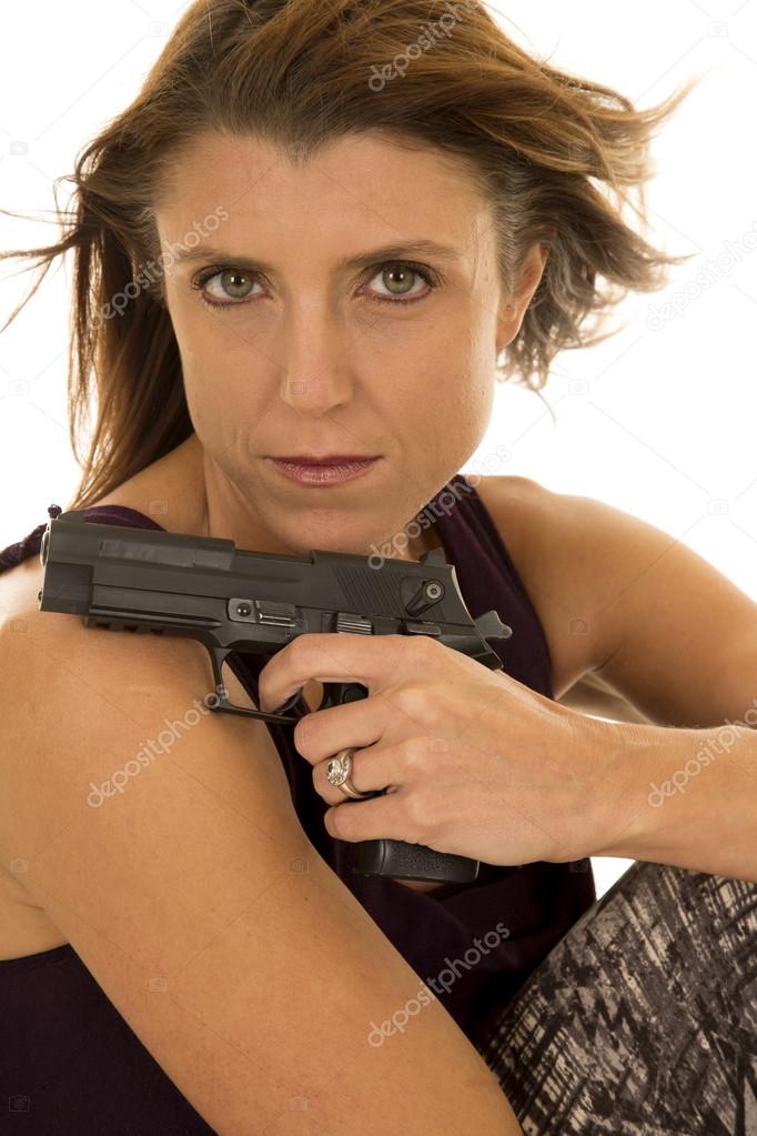 Woman with her pistol.