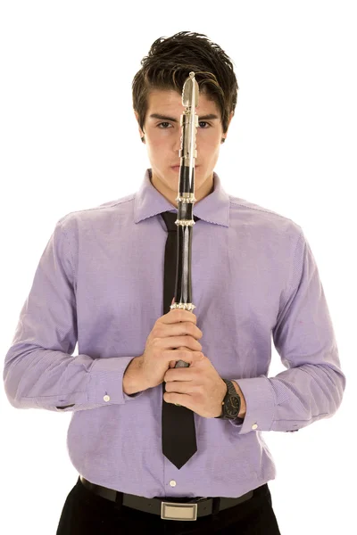 Man in purple dress shirt eyes on both sides of a hatchet — Stock Photo, Image