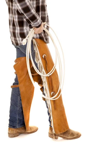 Cowboy legs chaps hold rope — Stock Photo, Image