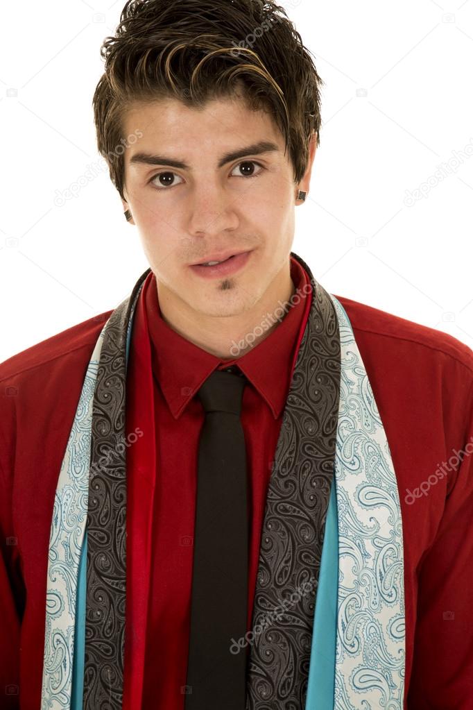 man in red shirt with lots of ties around neck looking
