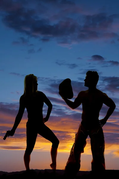 Woman with gun and cowboy — Stock Photo, Image