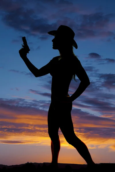 Silhouette of woman cowboy with gun — Stock Photo, Image