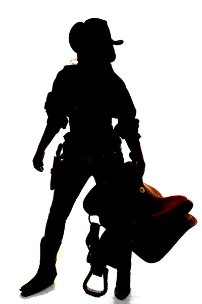 Silhouette of cowgirl  standing — Stock Photo, Image