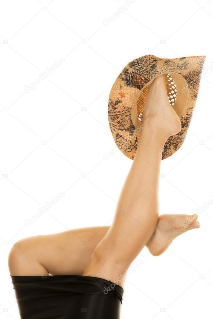 Woman legs  with cowboy hat