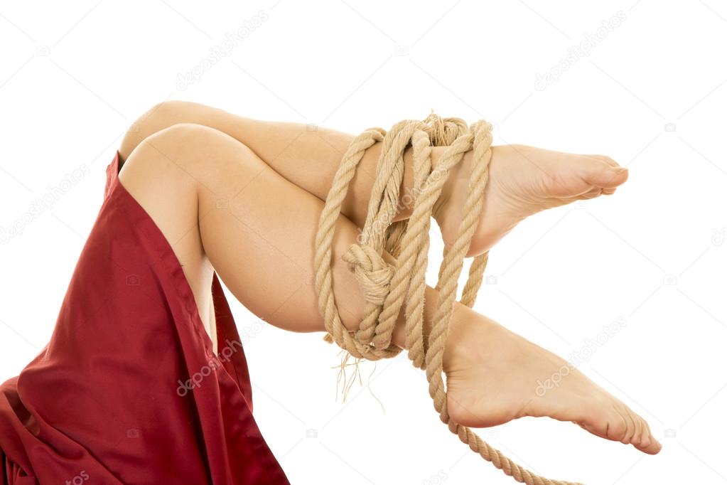 Woman legs  tied with rope