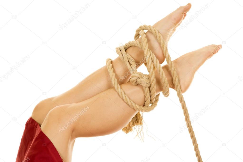 Woman legs  tied with rope