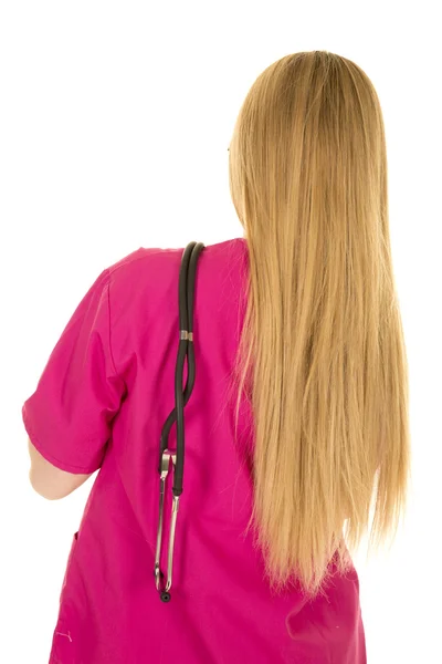 Enfermeira na vista traseira do terno rosa — Fotografia de Stock