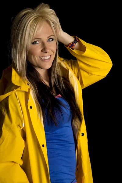 Woman in a yellow jacket — Stock Photo, Image