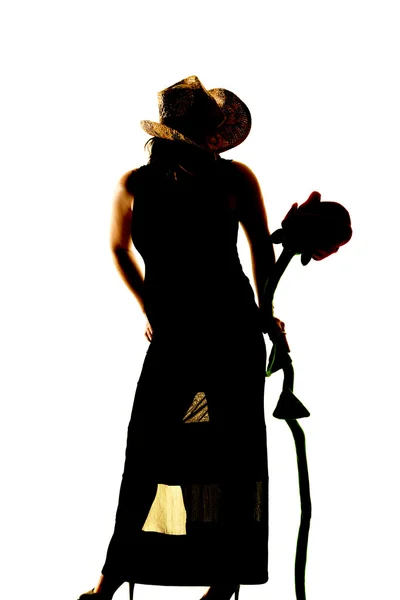 Sylwetka kobiety w kapelusz z kwiatem — Zdjęcie stockowe