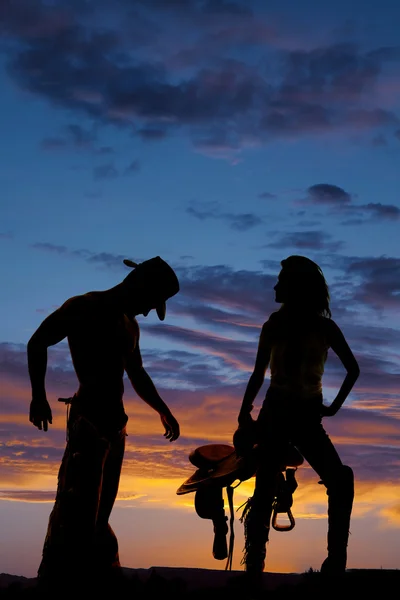 Silhuett av cowgirl och cowboy — Stockfoto