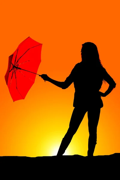 Silhouette of woman with umbrella — Stock Photo, Image