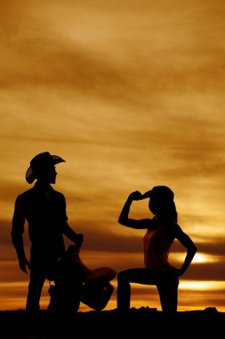 Silhouette cowgirl ve kovboy