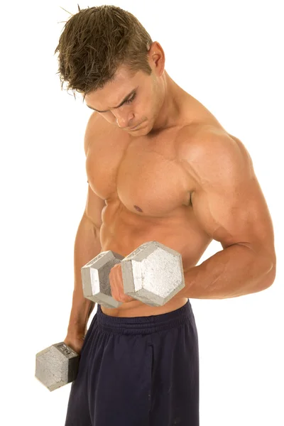 Young man exercising with dumbbells — Stock Photo, Image