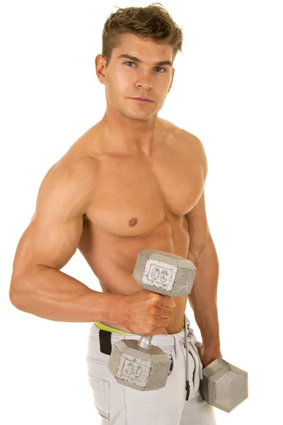 Young man exercising with dumbbells — Stock Photo, Image